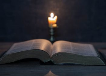 scriptures-candles-wooden-table